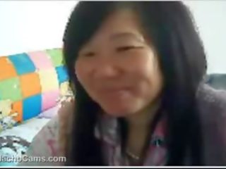 Middle-aged kitajka ženska vids off prsi